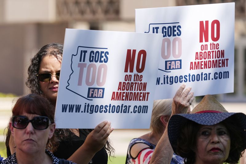 Pro-life supporters gather for a news conference after Arizona abortion-rights supporters deliver over 800,000 petition signatures to the capitol to get abortion rights on the November general election ballot Wednesday, July 3, 2024, in Phoenix. (AP Photo/Ross D. Franklin)