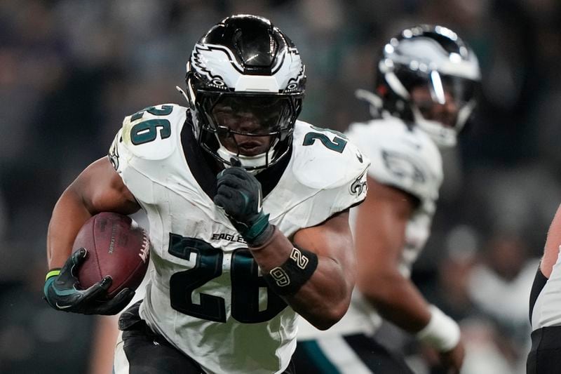 Philadelphia Eagles running back Saquon Barkley (26) runs for a touchdown against the Green Bay Packers during the first half of an NFL football game, Friday, Sept. 6, 2024, at the Neo Quimica Arena in Sao Paulo.(AP Photo/Doug Benc)