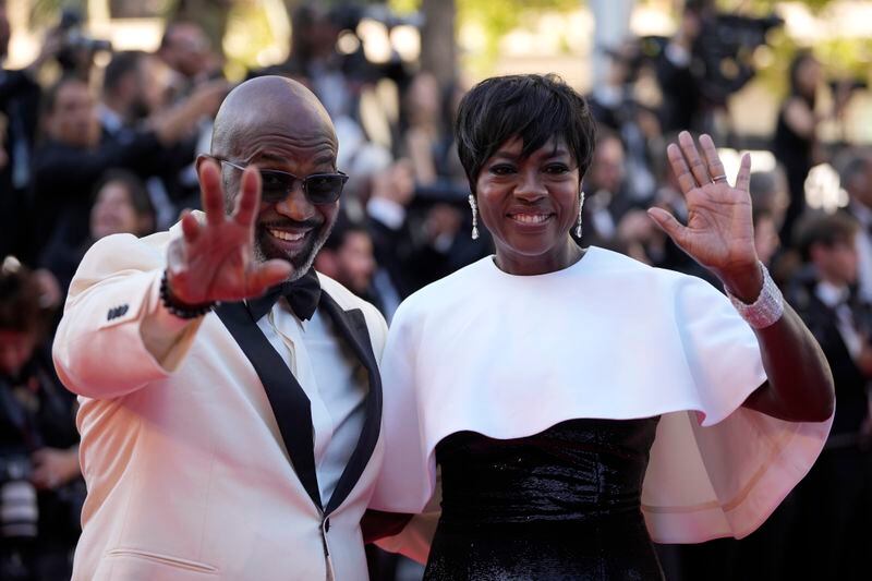 Julius Tennon, left, and Viola Davis pose for photographers upon arrival at the awards ceremony during the 77th international film festival, Cannes, southern France, Saturday, May 25, 2024. (Photo by Andreea Alexandru/Invision/AP)
