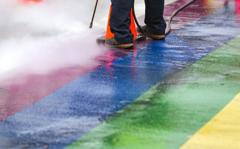 Black tire marks were cleaned off Midtown's rainbow crosswalks on Feb. 22, 2022, after street racers left behind damage. (John Spink / John.Spink@ajc.com)

