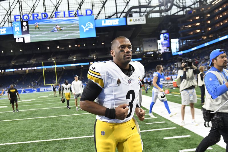 Pittsburgh Steelers quarterback Russell Wilson runs off the field after the second half of an NFL preseason football game against the Detroit Lions, Saturday, Aug. 24, 2024, in Detroit. (AP Photo/Jose Juarez)