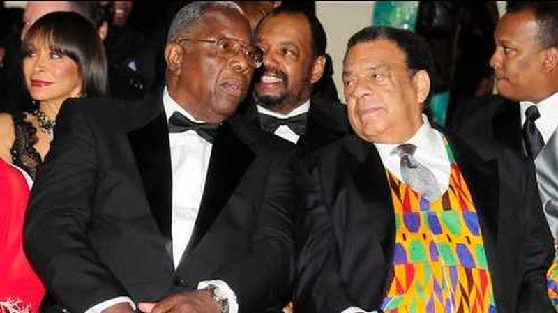 Baseball legend Hank Aaron and Ambassador Andrew Young talk at the Mayor’s Masked Ball. The two men helped start and grow the annual fundraiser for historically Black colleges and universities. AJC FILE