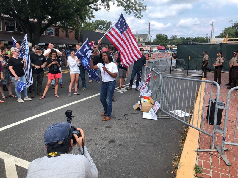 Atlanta Internet talk show host Lucretia Hughes brought her pro-Trump, pro-police message to a small but appreciative audience at the Dahlonega rally on Saturday, Sept. 14, 2019. (Photo: Chris Joyner/AJC)