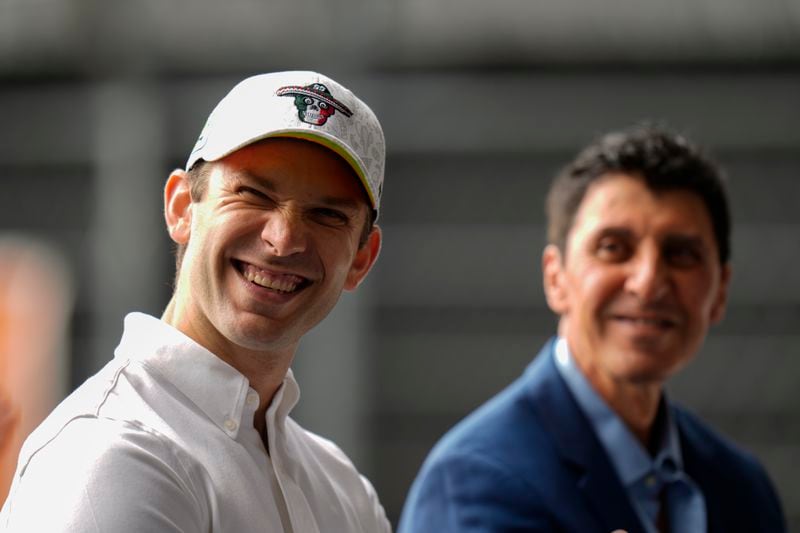 NASCAR driver Daniel Suarez, of Mexico, smiles alongside NASCAR Mexico Series CEO and President Jimmy Morales, during a press conference in Mexico City, Tuesday, Aug. 27, 2024. (AP Photo/Eduardo Verdugo)