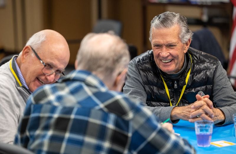 Volunteers Jim Howard (left) Ben Jenkins work on art project with a member during a Respite Care Atlanta meeting at Second-Ponce de Leon Baptist Church in Atlanta. 
PHIL SKINNER FOR THE ATLANTA JOURNAL-CONSTITUTION