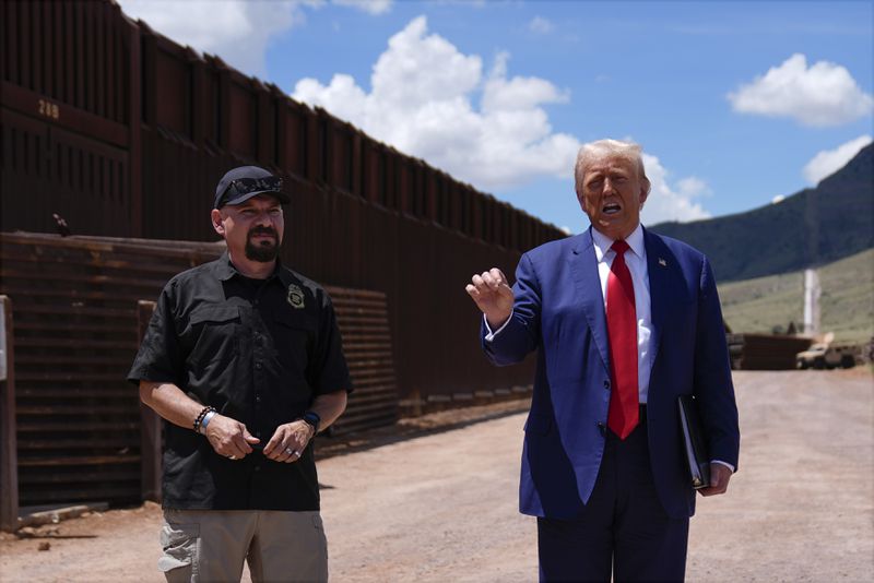 Republican presidential nominee former President Donald Trump talks as Paul Perez, president of the National Border Patrol Council, listens as he tours the southern border with Mexico, Thursday, Aug. 22, 2024, in Sierra Vista, Ariz. (AP Photo/Evan Vucci)