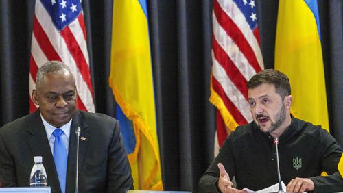 U.S. Defense Secretary Lloyd Austin, left, listens to Ukraine's President Volodymyr Zelenskyy during a meeting also with German's Defense Minister Boris Pistorius and Chairman of the Joint Chiefs of Staff Air Force of the U.S. Gen. CQ Brown at Ramstein Air Base in Ramstein-Miesenbach, Germany, Friday, Sept. 6, 2024. (Andreas Arnold/dpa via AP)