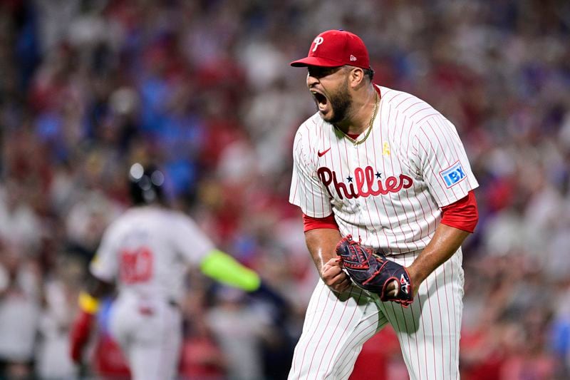 Philadelphia Phillies' Carlos Estévez reacts after striking out Atlanta Braves' Whit Merrifield during the 11th inning of a baseball game, Sunday, Sept. 1, 2024, in Philadelphia. (AP Photo/Derik Hamilton)