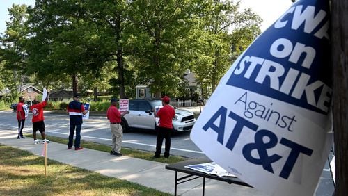 Striking AT&T workers hold signs outside AT&T facility on Brockett Road in Tucker on Aug. 30, 2024. The strike, which involved 17,000 workers in the region and 2,500 in metro Atlanta, ended Sunday, Sept. 15. (Hyosub Shin / AJC)