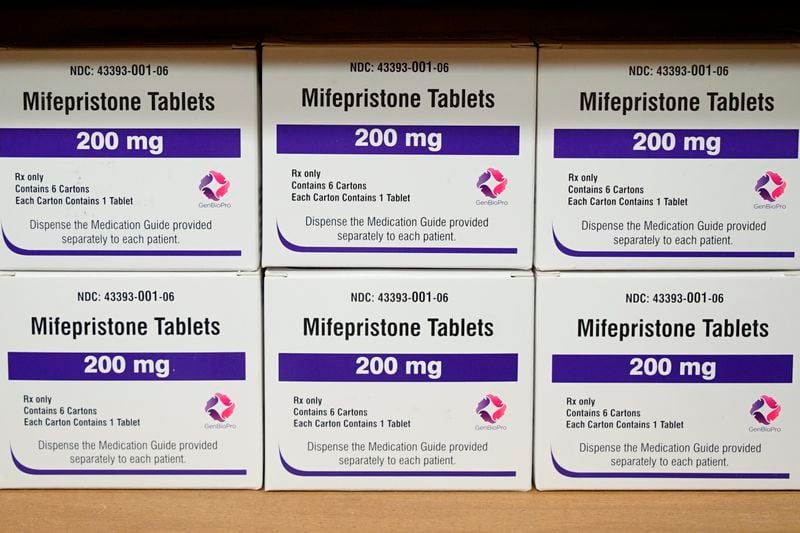 FILE - Boxes of the drug mifepristone sit on a shelf at the West Alabama Women's Center in Tuscaloosa, Ala., on March 16, 2022. Louisiana Gov. Jeff Landry has signed a first-of-its-kind bill Friday, May 24, classifying two abortion-inducing drugs, mifepristone and misoprostol, as controlled and dangerous substances. (AP Photo/Allen G. Breed, File)