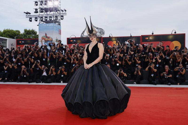 Lady Gaga poses for photographers upon arrival for the premiere of the film 'Joker: Folie A Deux' during the 81st edition of the Venice Film Festival in Venice, Italy, on Wednesday, Sept. 4, 2024. (Photo by Joel C Ryan/Invision/AP)