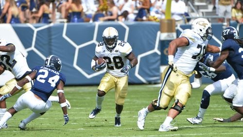 Georgia Tech running back J.J. Green (28) runs against Georgia Southern defensive back Sean Freeman (24) in the first half at Bobby Dodd Stadium on Saturday, October 15, 2016. HYOSUB SHIN / HSHIN@AJC.COM