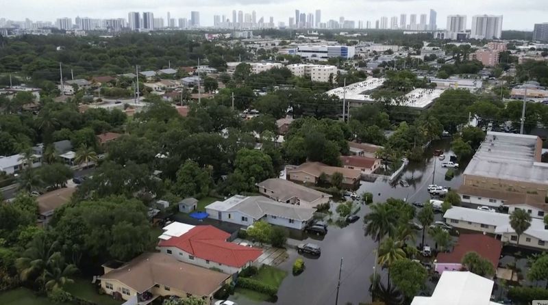 This arial view taken from video shows a flooded street in Northeast Miami-Dade County on Thursday, June 13, 2024. A tropical disturbance brought a rare flash flood emergency to much of southern Florida the day before. Floridians prepared to weather more heavy rainfall on Thursday and Friday. (AP Photo/Daniel Kozin)