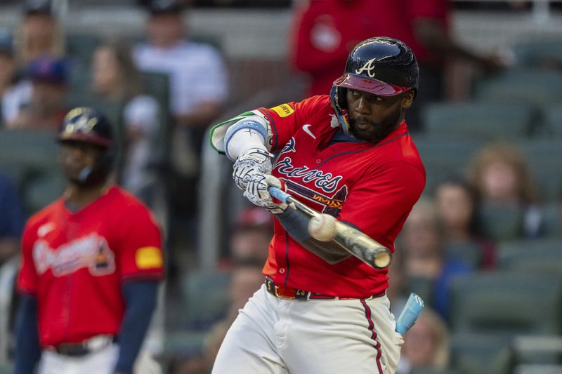 Atlanta Braves' Michael Harris II hits a line drive to center field in the third inning of a baseball game against the Washington Nationals, Friday, Aug. 23, 2024, in Atlanta. (AP Photo/Jason Allen)