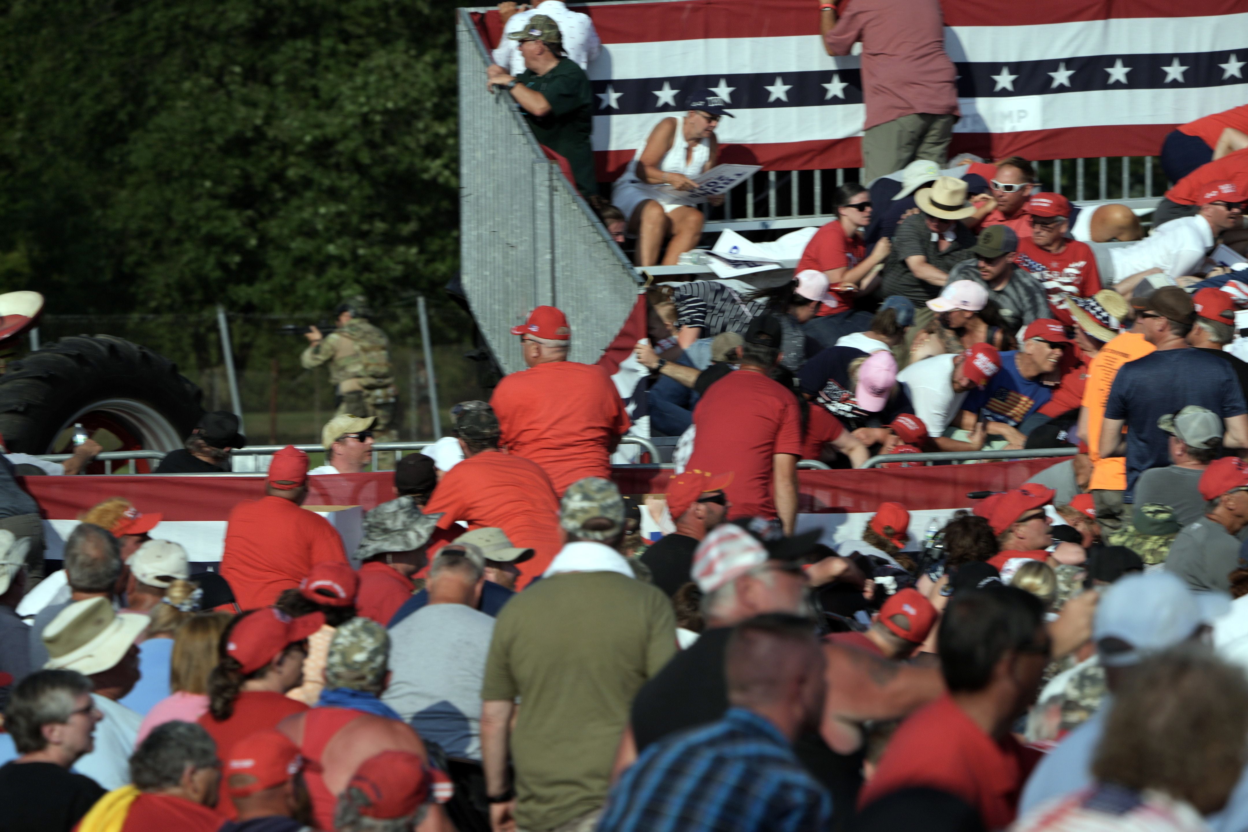 People react after a series of pops that sounded like gunshots as former President Donald Trump appears at a campaign rally in Butler, Pa, on Saturday, July, 13, 2024. (Eric Lee/The New York Times)