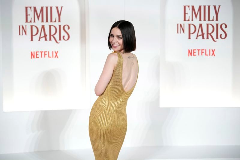 Actress Lily Collins arrives at the premiere of "Emily in Paris", in Rome, Tuesday, Sept. 10, 2024. (AP Photo/Andrew Medichini)