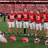 Georgia quarterbacks (from left) Collin Drake, Jackson Muschamp, Carson Beck, Gunner Stockton, Stetson Bennett and Brock Vandagriff pose for a photograph after their 55-0 win against Vanderbilt last season. The Bulldogs are searching for their next quarterback, and the competition is underway. (Jason Getz file photo / Jason.Getz@ajc.com)