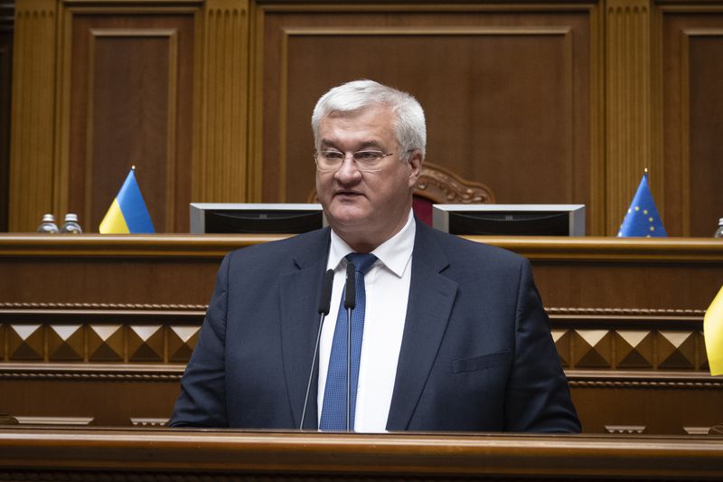 In this photo provided by the Ukrainian Parliament Press Office, Ukraine's newly appointed Foreign Minister Andrii Sybiha speaks in parliament in Kyiv, Ukraine, Thursday, Sept. 5, 2024. (Andrii Nesterewnko/Ukrainian Parliament Press Office via AP)