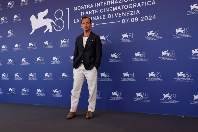 Jude Law poses for photographers at the photo call for the film 'The Order' during the 81st edition of the Venice Film Festival in Venice, Italy, on Saturday, Aug. 31, 2024. (Photo by Joel C Ryan/Invision/AP)