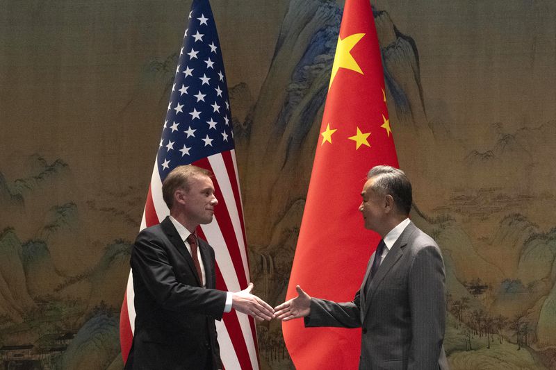 Wang Yi, right, the director of the Communist Party's Central Foreign Affairs Commission Office shakes hands with White House national security adviser Jake Sullivan, left, before their talk at Yanqi lake in Beijing, Tuesday, Aug. 27, 2024. (AP Photo/Ng Han Guan, Pool)