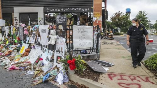 Atlanta police and sanitation crews finish removing protesters and their belongings Monday from outside the Wendy’s where Rayshard Brooks was killed by an officer last month and near where 8-year-old Secoriea Turner was fatally shot while sitting in a car over the July Fourth weekend. JOHN SPINK / JSPINK@AJC.COM