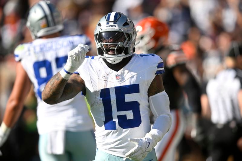 Dallas Cowboys running back Ezekiel Elliott celebrates after rushing for a touchdown against the Cleveland Browns in the first half of an NFL football game in Cleveland, Sunday, Sept. 8, 2024. (AP Photo/David Richard)