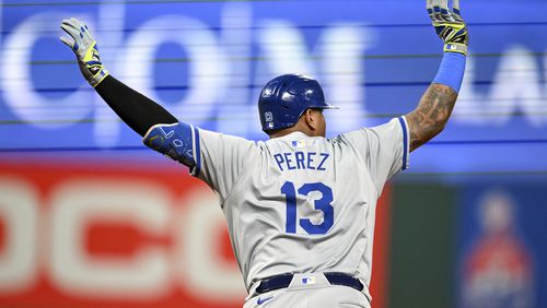 Kansas City Royals' Salvador Perez celebrates hitting a grand slam during the sixth inning of the second game of a baseball doubleheader against the Cleveland Guardians, Monday, August 26, 2024, in Cleveland. (AP Photo/Nick Cammett)