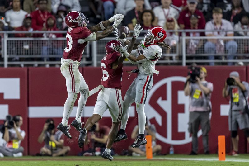 Alabama defensive back Keon Sabb (3) and Alabama defensive back Red Morgan (16) defend a pass to Georgia wide receiver Anthony Evans III (5) which fell incomplete during the second half of an NCAA college football game, Saturday, Sept. 28, 2024, in Tuscaloosa, Ala. (AP Photo/Vasha Hunt)