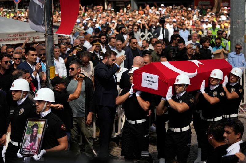 Turkish military police carry the coffin of Aysenur Ezgi Eygi, a 26 year-old Turkish-American activist killed by the Israeli military, for the funeral prayer outside the central mosque of Didim, Turkey, Saturday, Sept. 14, 2024,(AP Photo/Khalil Hamra)