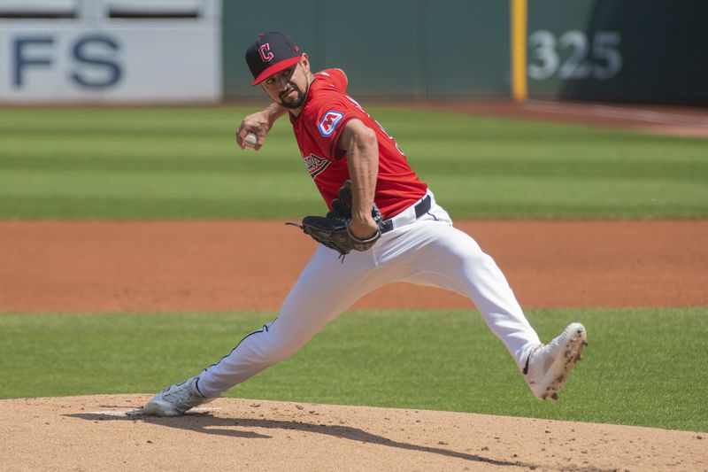 Cleveland Guardians starting pitcher Nick Sandlin delivers against the Kansas City Royals during the first inning of the first game of a baseball doubleheader in Cleveland, Monday, Aug. 26, 2024. (AP Photo/Phil Long)