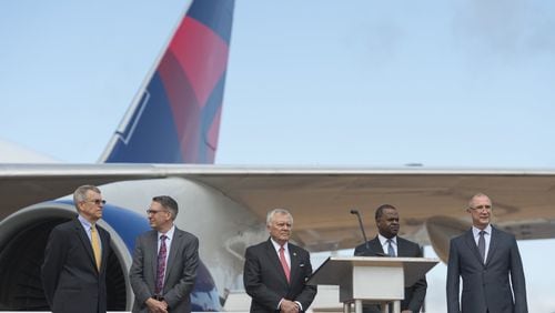 From left, John Boatright, President of the Delta Flight Museum; Randy Tinseth, Vice President of Marketing at Boeing; Georgia Gov. Nathan Deal; Atlanta Mayor Kasim Reed; and Glen Hauenstein, President of Delta Air Lines, prepare for a ceremony to open the new 747 Experience at Delta’s Atlanta museum. (DAVID BARNES / DAVID.BARNES@AJC.COM)