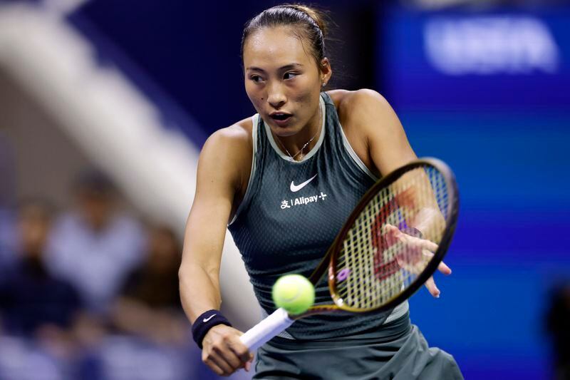 Zheng Qinwen, of China, returns a shot to Donna Veki, of Croatia, during the fourth round of the U.S. Open tennis tournament Monday, Sept. 2, 2024, in New York. (AP Photo/Adam Hunger)