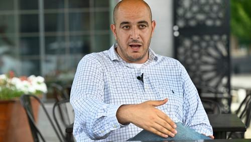 Uncommitted delegate to the Democratic National Convention Abbas Alawieh answers questions during an interview Wednesday, Aug. 14, 2024, in Dearborn, Mich. (AP Photo/Jose Juarez)