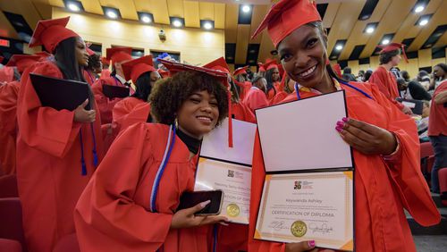 Keywanda Ashley, right, and Naomy Seiry Arzu Cruz show off their high school equivalency (HiSET) diplomas during a graduation ceremony for the Youth Empowerment Project (YEP), a New Orleans-based non-profit organization which received money from the NBA Foundation program in New Orleans, Thursday, June 27, 2024. (AP Photo/Matthew Hinton)