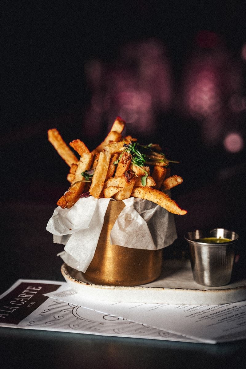 Damsel fries are seasoned with red curry and served with Thai coconut sauce. (Sonder Media House)