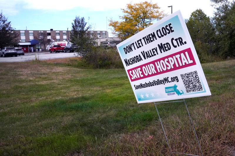 A "Save Our Hospital" sign is displayed outside the former Nashoba Valley Medical Center, which closed on Aug. 31, 2024 and was part of the bankrupt Steward Health Care company, Thursday, Sept. 19, 2024, in Ayer, Mass. (AP Photo/Charles Krupa)