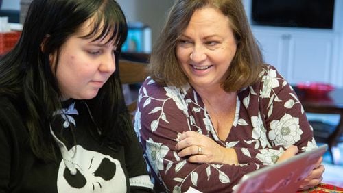 Stephanie Fuhrmannek helps her daughter Emily with her math homework at their Dacula home on January 8, 2020.  STEVE SCHAEFER FOR THE ATLANTA JOURNAL-CONSTITUTION