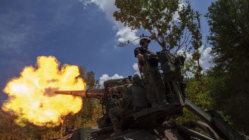 Ukrainian soldiers, of 43rd artillery brigade, fire by 2s7 self-propelled howitzer towards Russian positions at the frontline in Donetsk region, Ukraine, Monday, June 10, 2024. (AP Photo/Evgeniy Maloletka)