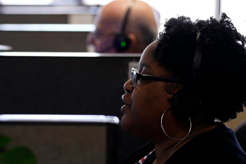 Customer Experience Representative Cassia Jones-Woodard takes calls at an Alorica center, Monday, Aug. 19, 2024, in San Antonio. (AP Photo/Eric Gay)