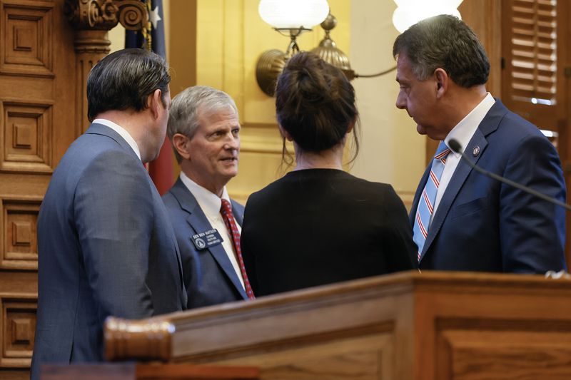 (Left to right) Lt. Gov. Burt Jones, Sen. Ben Watson (R-Moultrie), Jones’ chief of staff Loree Anne Paradise and Sen. Steve Gooch (R-Dahlonega) have a conversation in Senate chambers on day 27 of the legislative session on Thursday, March 2, 2023. Today is Crossover Day at the state Capitol. (Natrice Miller/The Atlanta Journal-Constitution)