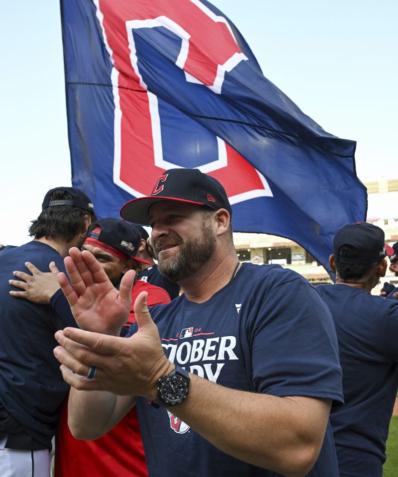 Cleveland Guardians manager Stephen Vogt celebrates the team's 3-2, 10-inning win over the Minnesota Twins which earned the team a berth in baseball's playoff, Thursday, Sept. 19, 2024, in Cleveland. (AP Photo/Nick Cammett)