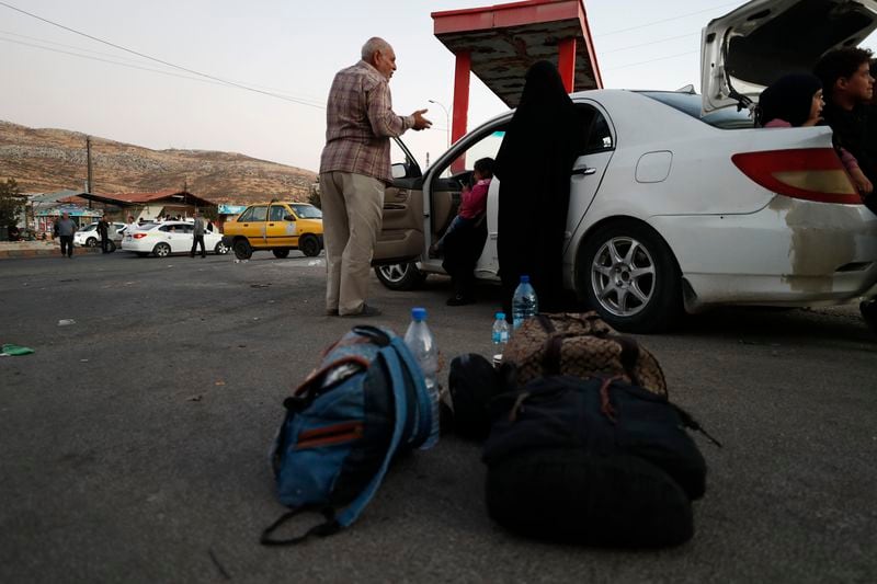 Lebanese fleeing the Israeli bombardment, arrive at the Syrian-Lebanese border crossing in Jdaidet Yabous, Syria, Tuesday, Sept. 24, 2024. (AP Photo/Omar Sanadiki)