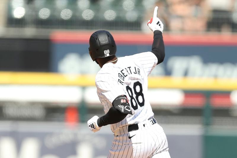 Chicago White Sox's Luis Robert Jr. reacts after hitting a home run during the first inning of a baseball game against the Atlanta Braves Thursday, June 27, 2024, in Chicago. (AP Photo/Melissa Tamez)