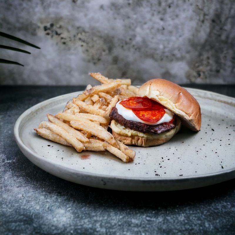 The pizza burger ($12) will be served during the 2023 SEC Championship Game at the 300 level Molly B's concession stand.