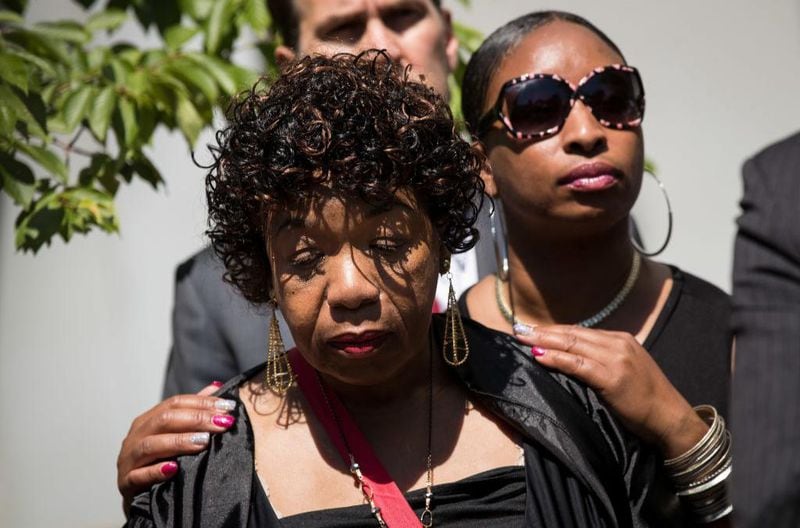 Gwen Carr, mother of the late Eric Garner, is consoled by Ellisha Garner during a press conference after meeting with Department of Justice officials, June 21, 2017 in the Brooklyn borough of New York City. The family was expected to receive a status report on the progress of the civil rights investigation into Eric Garner's police-involved choking death. 
