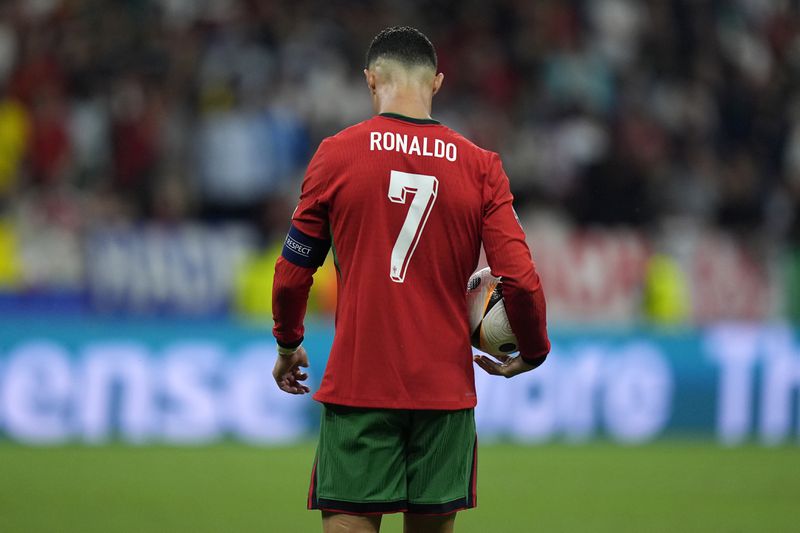 Portugal's Cristiano Ronaldo prepares to kick a penalty during a round of sixteen match between Portugal and Slovenia at the Euro 2024 soccer tournament in Frankfurt, Germany, Monday, July 1, 2024. (AP Photo/Matthias Schrader)