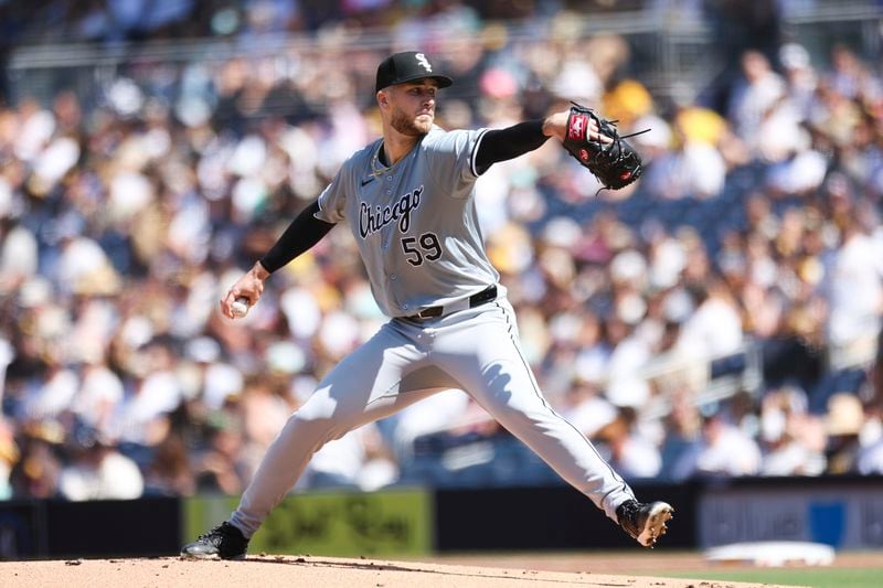 Chicago White Sox starting pitcher Sean Burke winds up against a San Diego Padres' batter in the first inning of a baseball game, Sunday, Sept. 22, 2024, in San Diego. (AP Photo/Derrick Tuskan)