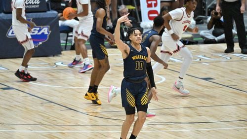 Wheeler's Jelani Hamilton (10) celebrates after scoring during 2023 GHSA Basketball Class 7A Boy’s State Championship game at the Macon Centreplex, Saturday, March 11, 2023, in Macon, GA. (Hyosub Shin / Hyosub.Shin@ajc.com)
