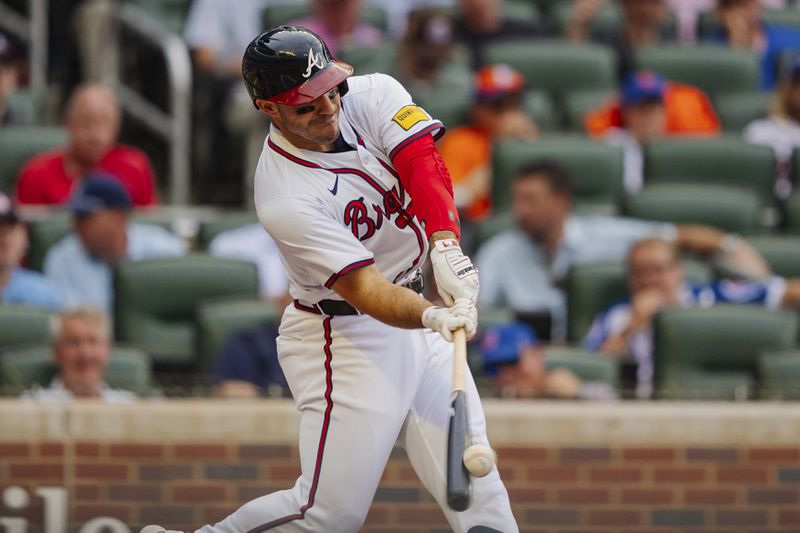 Atlanta Braves' Ramon Laureano hits a home run to center field in the sixth inning of a baseball game against the New York Mets, Monday, Sept. 30, 2024, in Atlanta. (AP Photo/Jason Allen)