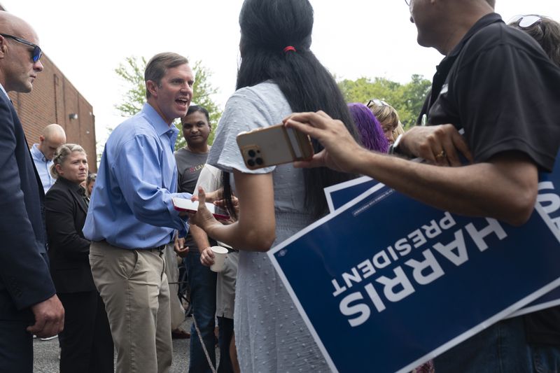 Kentucky Gov. Andy Beshear campaigns for Vice President Kamala Harris at an event in Cumming on Sunday.